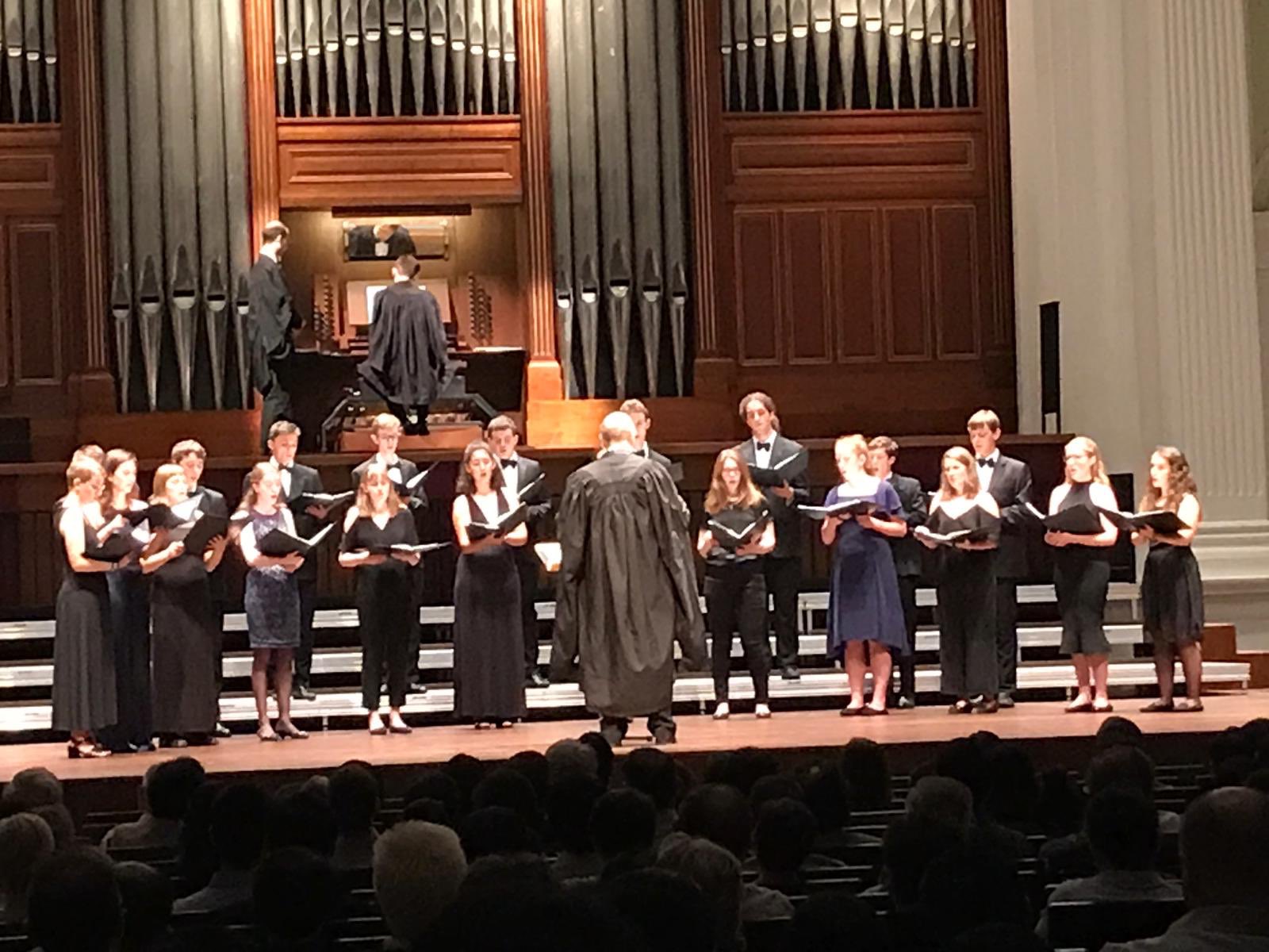 Choir singing in concert hall