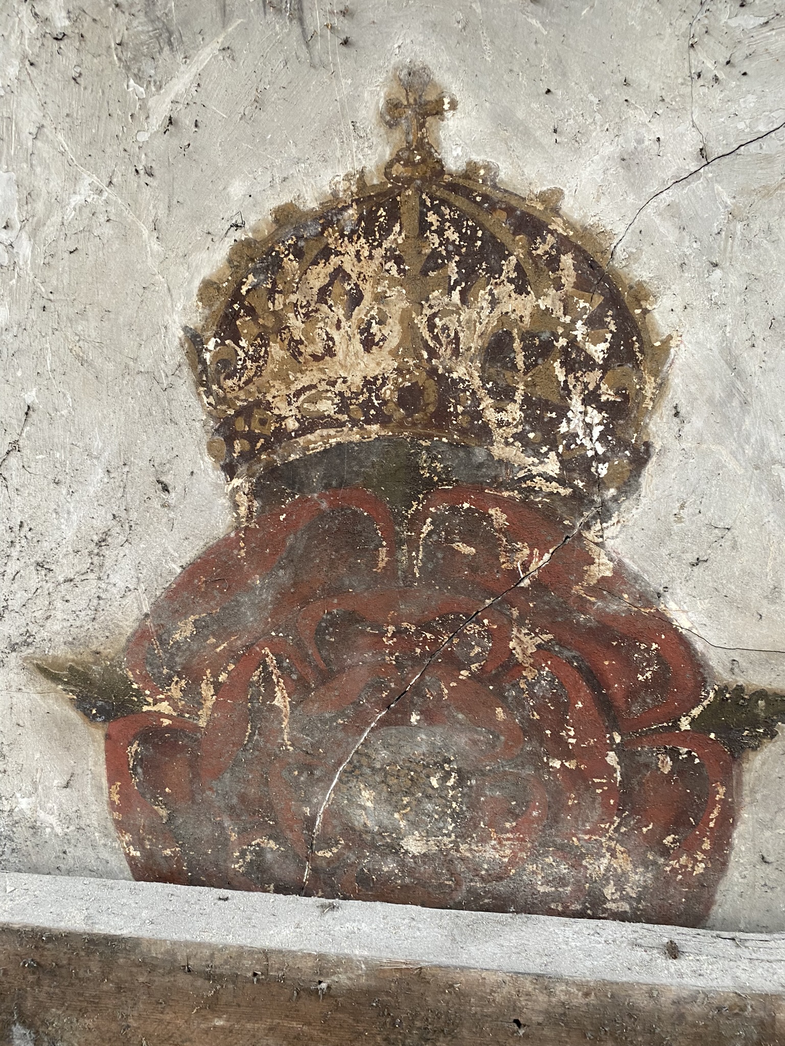 Wall painting of rose with a crown above