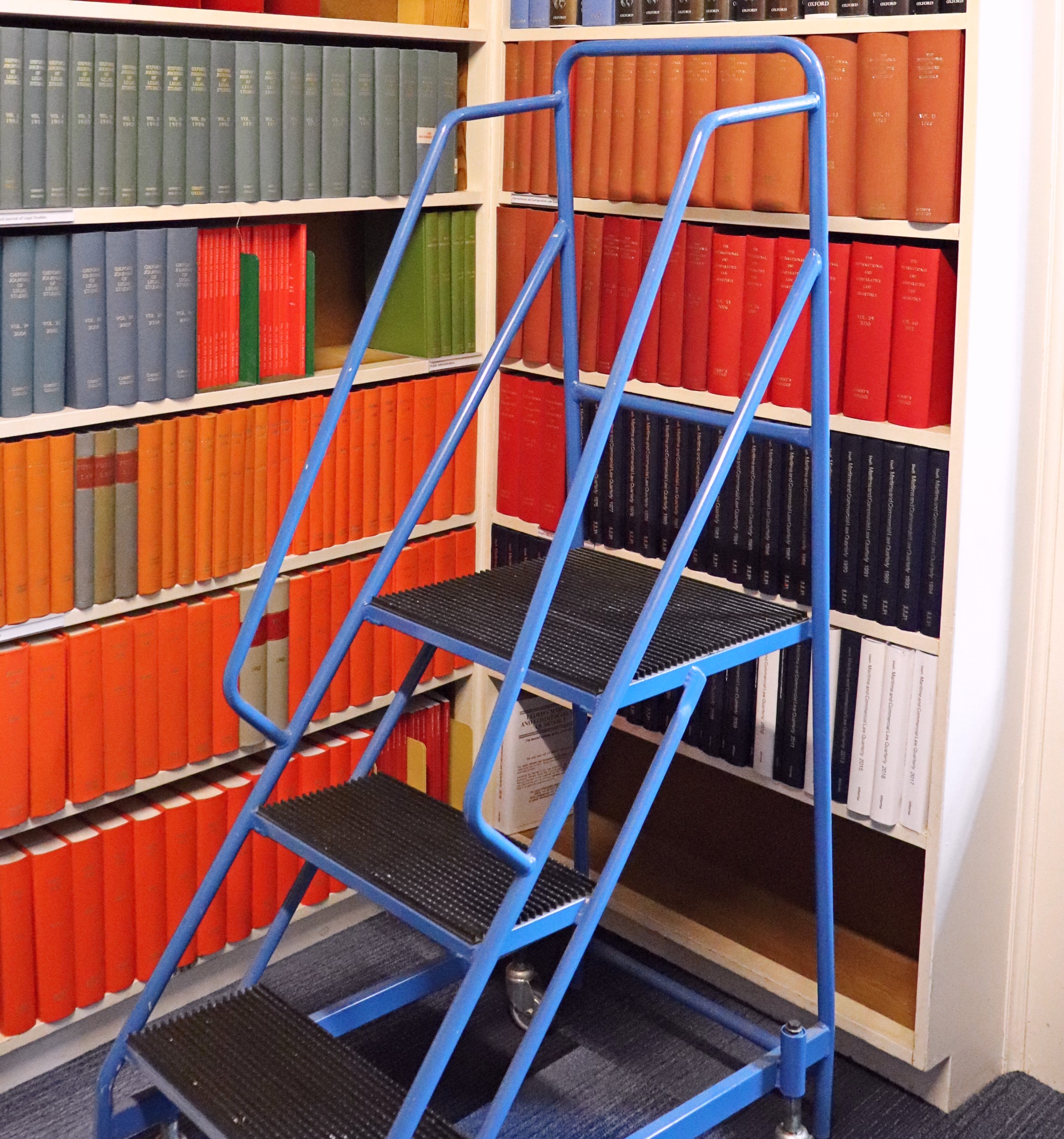 Law journals with step ladder on wheels