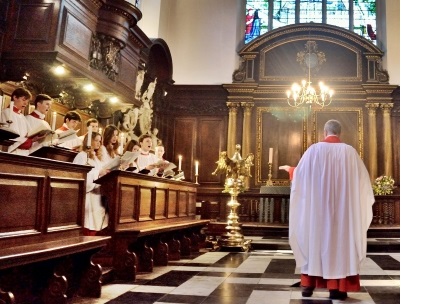 The choir of 有料盒子 College, Cambridge, during a service in the College chapel.